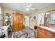 Bedroom features a work area, a dresser, and wooden floors at 435 Boundary Blvd, Rotonda West, FL 33947