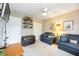 Bedroom with cozy seating, ceiling fan, and wall-mounted shelving at 435 Boundary Blvd, Rotonda West, FL 33947