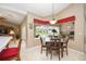 Charming dining area with views of the lanai and swimming pool at 435 Boundary Blvd, Rotonda West, FL 33947
