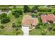 Beautiful home featuring a screened-in pool, well-manicured lawn, and a spacious driveway at 435 Boundary Blvd, Rotonda West, FL 33947