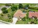 Lovely home with a private screened-in pool, mature trees, and well-maintained landscaping at 435 Boundary Blvd, Rotonda West, FL 33947