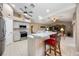 Modern kitchen with stainless steel appliances, granite countertops, an island with breakfast bar seating at 435 Boundary Blvd, Rotonda West, FL 33947