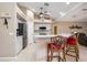 Open kitchen featuring updated appliances, marble countertop, and barstool seating at 435 Boundary Blvd, Rotonda West, FL 33947