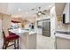 Well-lit kitchen featuring stainless steel appliances and a breakfast bar with seating at 435 Boundary Blvd, Rotonda West, FL 33947