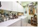 Well-organized laundry room featuring white cabinets, counter space, washer, and dryer at 435 Boundary Blvd, Rotonda West, FL 33947