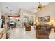 Bright living room featuring tiled floors, dining set, and wicker furniture at 435 Boundary Blvd, Rotonda West, FL 33947
