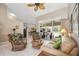 Cozy living room with a sliding glass door leading to an outdoor pool area at 435 Boundary Blvd, Rotonda West, FL 33947