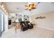 Open concept living area with kitchen, living room furniture, and sliding glass doors at 435 Boundary Blvd, Rotonda West, FL 33947
