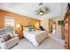 Inviting main bedroom with a ceiling fan and furnishings, offering a tranquil retreat at 435 Boundary Blvd, Rotonda West, FL 33947