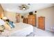 Comfortable main bedroom boasts ample closet space and a ceiling fan at 435 Boundary Blvd, Rotonda West, FL 33947
