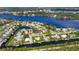 Aerial view of coastal homes along canals, providing waterfront living with boat access to the bay at 458 Ceil Ct, Nokomis, FL 34275