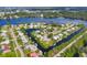 Aerial view of canal-front neighborhood showcasing waterfront homes with docks and boat access at 458 Ceil Ct, Nokomis, FL 34275