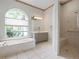 Bathroom with a garden tub, a separate shower, and a large vanity with ample counter space at 467 Sherbrooke Ct, Venice, FL 34293