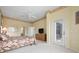 Bedroom with access to en-suite bath and deck and a contemporary ceiling fan at 467 Sherbrooke Ct, Venice, FL 34293