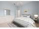 Bright bedroom with a plush bed, dresser, and stylish decor at 467 Sherbrooke Ct, Venice, FL 34293