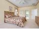 Spacious bedroom with en-suite bathroom and doorway access; the room is carpeted and has neutral decor at 467 Sherbrooke Ct, Venice, FL 34293