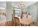 Light-filled dining area overlooking the lanai and golf course at 467 Sherbrooke Ct, Venice, FL 34293