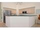Bright kitchen with stainless steel appliances, ample cabinet space, and a convenient breakfast bar at 467 Sherbrooke Ct, Venice, FL 34293