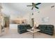 Large living room features tile floors, vaulted ceilings, and flows into an open kitchen at 467 Sherbrooke Ct, Venice, FL 34293