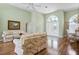 Inviting living room with vaulted ceilings, hardwood floors, and decorative double-door entryway at 467 Sherbrooke Ct, Venice, FL 34293