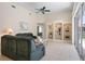 Spacious living room with tile floors, large windows, and built-in display shelves at 467 Sherbrooke Ct, Venice, FL 34293