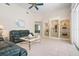 Inviting living room with tile floors, display shelves, and lots of natural light at 467 Sherbrooke Ct, Venice, FL 34293