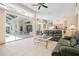 Open concept living room with sliding glass doors leading to the patio and an outdoor living area at 467 Sherbrooke Ct, Venice, FL 34293
