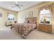 Cozy primary bedroom with soft carpet, lots of natural light, and neutral decor at 467 Sherbrooke Ct, Venice, FL 34293