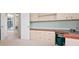 Well-lit home office featuring custom built-in cabinets, drawers and shelves at 467 Sherbrooke Ct, Venice, FL 34293