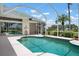 Private screened-in pool surrounded by lush greenery and views of the golf course at 467 Sherbrooke Ct, Venice, FL 34293