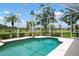Screened-in pool offers views of the golf course and lush landscaping at 467 Sherbrooke Ct, Venice, FL 34293