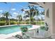 Screened-in pool and patio area featuring views of a golf course at 467 Sherbrooke Ct, Venice, FL 34293