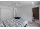 Bright bedroom with a ceiling fan, double closets, and ensuite bathroom at 4688 Maraldo Ave, North Port, FL 34287