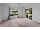 Bright bedroom with natural light and sliding glass doors to the backyard at 4688 Maraldo Ave, North Port, FL 34287