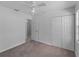 Bright bedroom featuring neutral carpet, ceiling fan, and spacious closet at 4688 Maraldo Ave, North Port, FL 34287