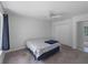 Bedroom with carpet flooring, a ceiling fan and a closet and window overlooking the side yard at 4688 Maraldo Ave, North Port, FL 34287