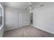 Bright bedroom featuring neutral carpet, ceiling fan, and spacious closet at 4688 Maraldo Ave, North Port, FL 34287