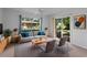Cozy living room with neutral tones, comfortable seating and backyard views at 4688 Maraldo Ave, North Port, FL 34287