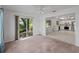 Open concept living room leading to a kitchen and a sliding door to the backyard at 4688 Maraldo Ave, North Port, FL 34287
