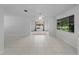 Bright living room with tile flooring and views of the backyard at 4688 Maraldo Ave, North Port, FL 34287