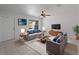 Stylishly furnished living room with tile flooring, a large window and comfortable seating at 4688 Maraldo Ave, North Port, FL 34287