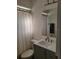 Bathroom featuring a vanity with modern fixtures, mirror, and window with privacy curtain at 482 Pendleton Pl, Venice, FL 34292