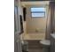Bathroom features a tub with shower, tiled walls, and contemporary toilet and vanity at 482 Pendleton Pl, Venice, FL 34292