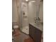 Modern bathroom with glass enclosed shower and marble countertop at 482 Pendleton Pl, Venice, FL 34292