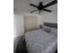 Bright bedroom with a ceiling fan, comfortable bed, and sliding closet doors at 482 Pendleton Pl, Venice, FL 34292