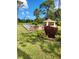 Scenic view of a bocce ball court, community pavilion, and lush landscaping at 482 Pendleton Pl, Venice, FL 34292