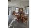Bright dining area with wood table and chairs and natural light at 482 Pendleton Pl, Venice, FL 34292