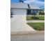 Charming single-story home featuring a well-maintained lawn and a two-car garage at 482 Pendleton Pl, Venice, FL 34292