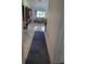 Inviting hallway with tiled floors leading into a cozy living space with warm decor at 482 Pendleton Pl, Venice, FL 34292