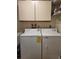 A full-size washer and dryer offer convenience for laundry needs, streamlining household chores at 482 Pendleton Pl, Venice, FL 34292